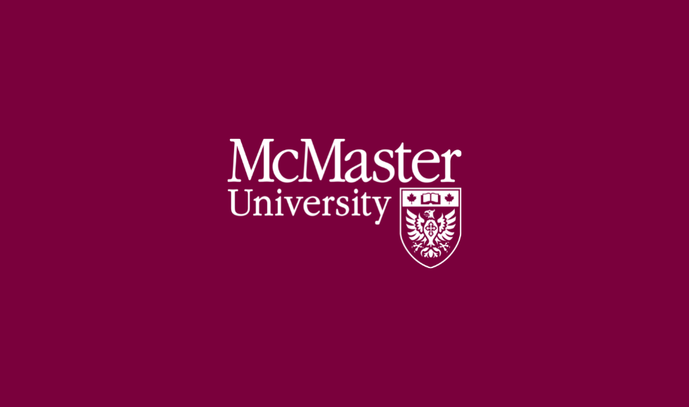 McMaster logo white on maroon background