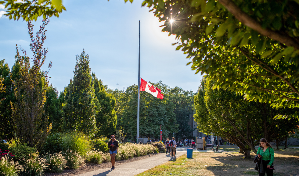 The Canadian flag at half-mast at the centre of campus