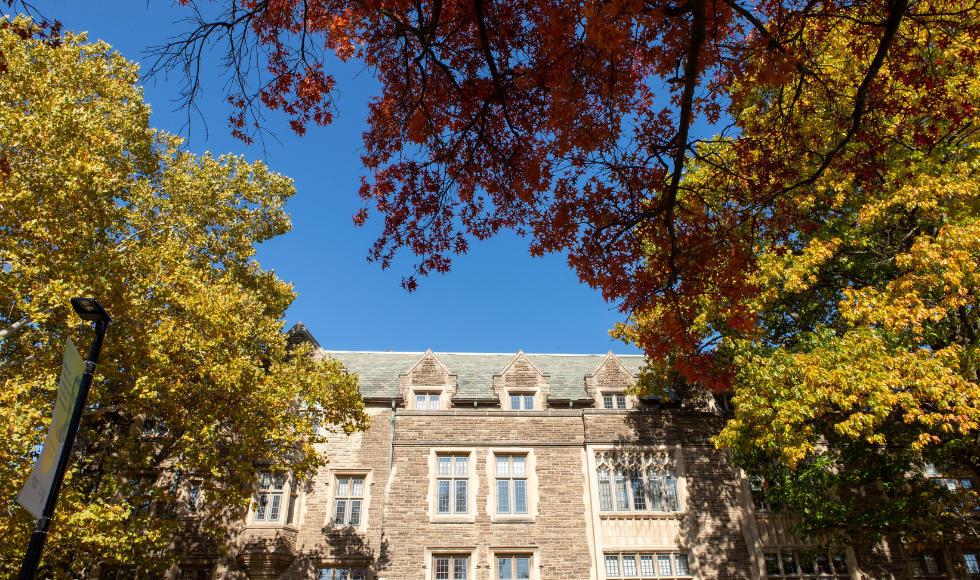 The exterior of University Hall in Fall showing leaves changing colour.