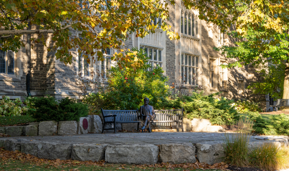 The Senator McMaster Statue on McMaster's campus surrounded by greenery.