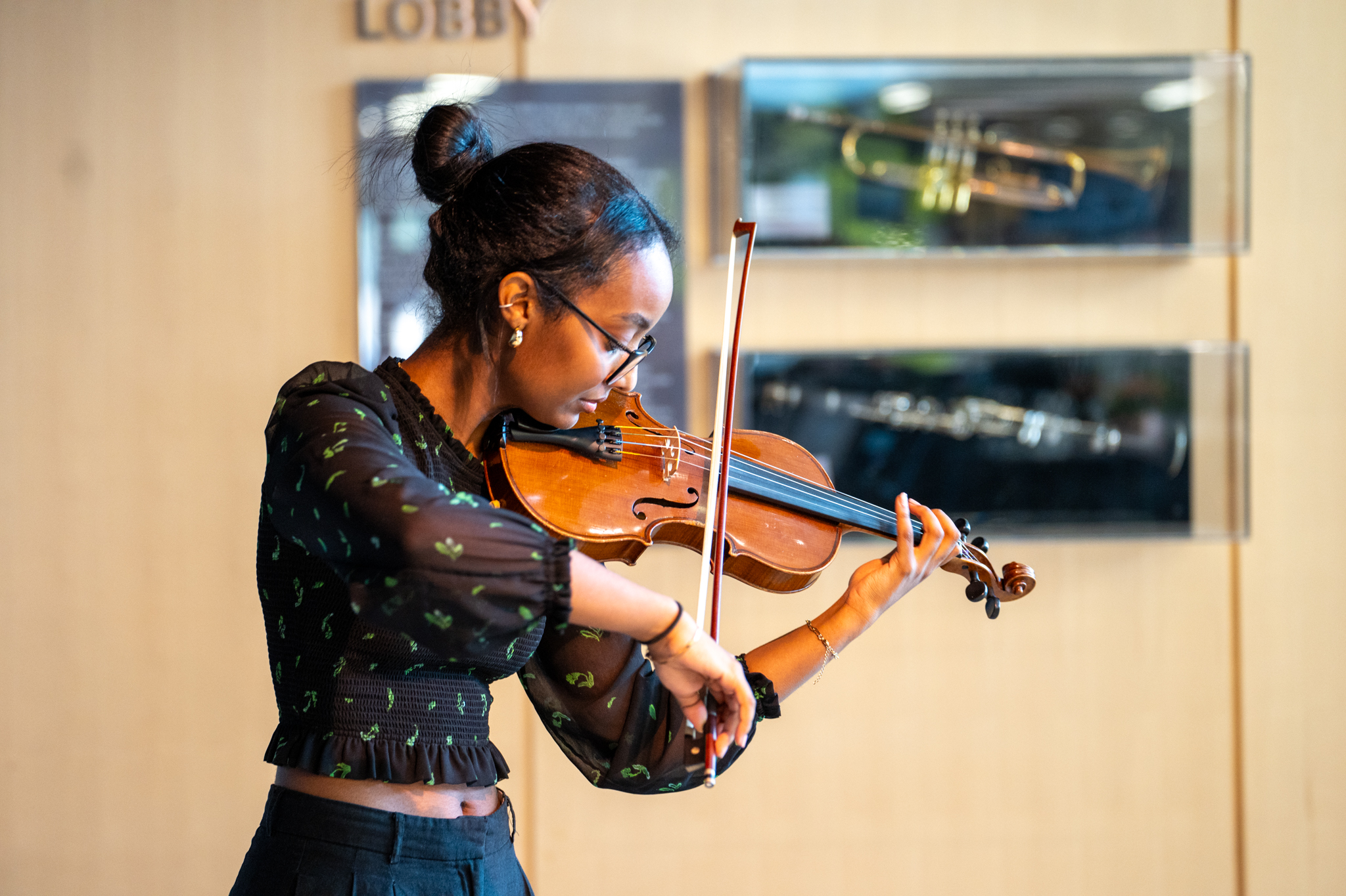 A McMaster student playing a violin