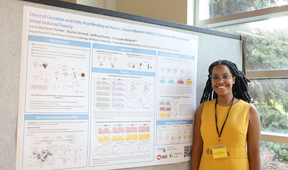 Image of Karla, standing beside a white board with scientific methodologies and backgrounds.