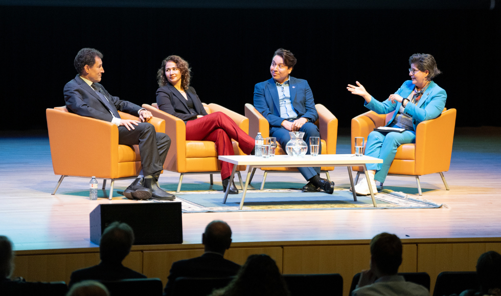 Image of Steve Paikin, Medora Uppal, Mark Hill and Sara Wolfe all sitting on a panel talking