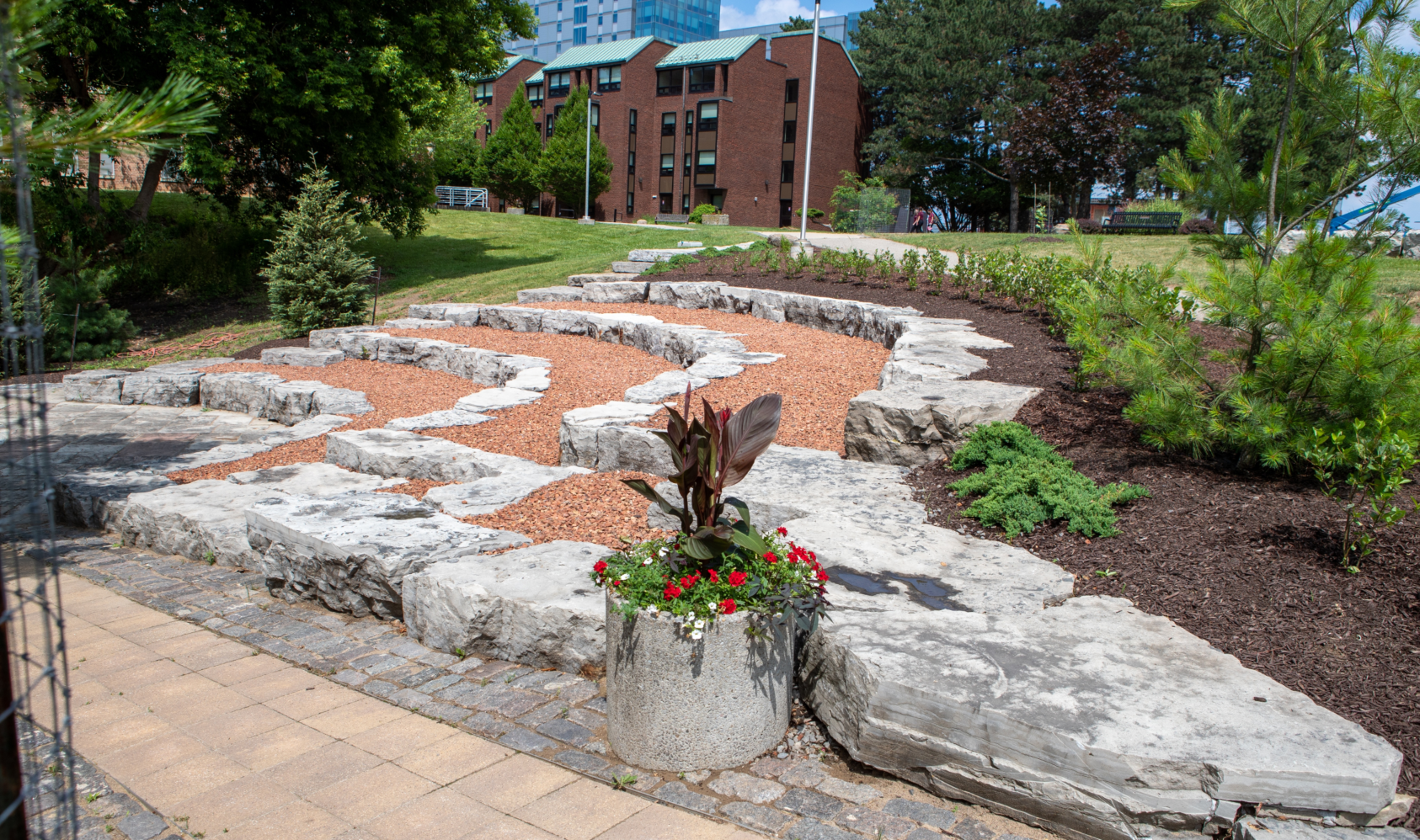 Side view of the stone seating area at the Indigenous Circle on McMaster's campus.
