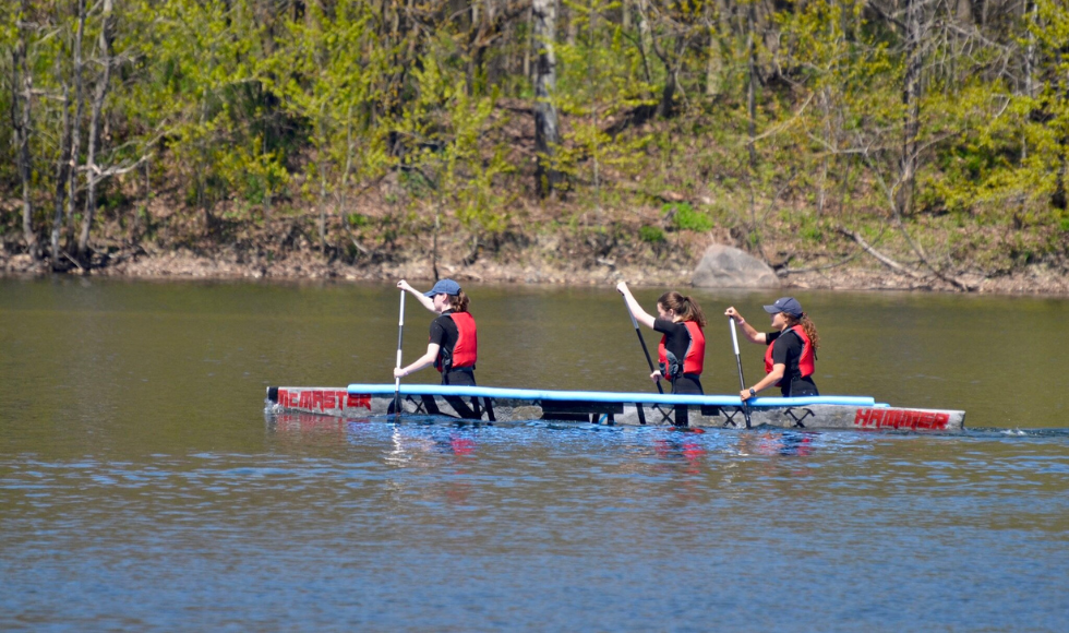 3 students paddle McMaster's 2024 concrete canoe