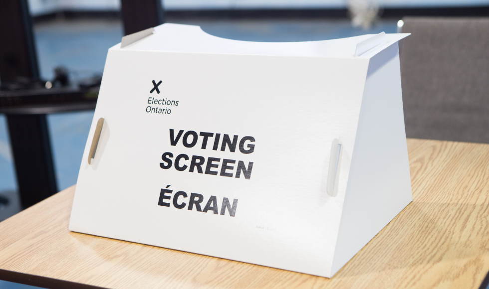 an elections ontario voting screen on a table.