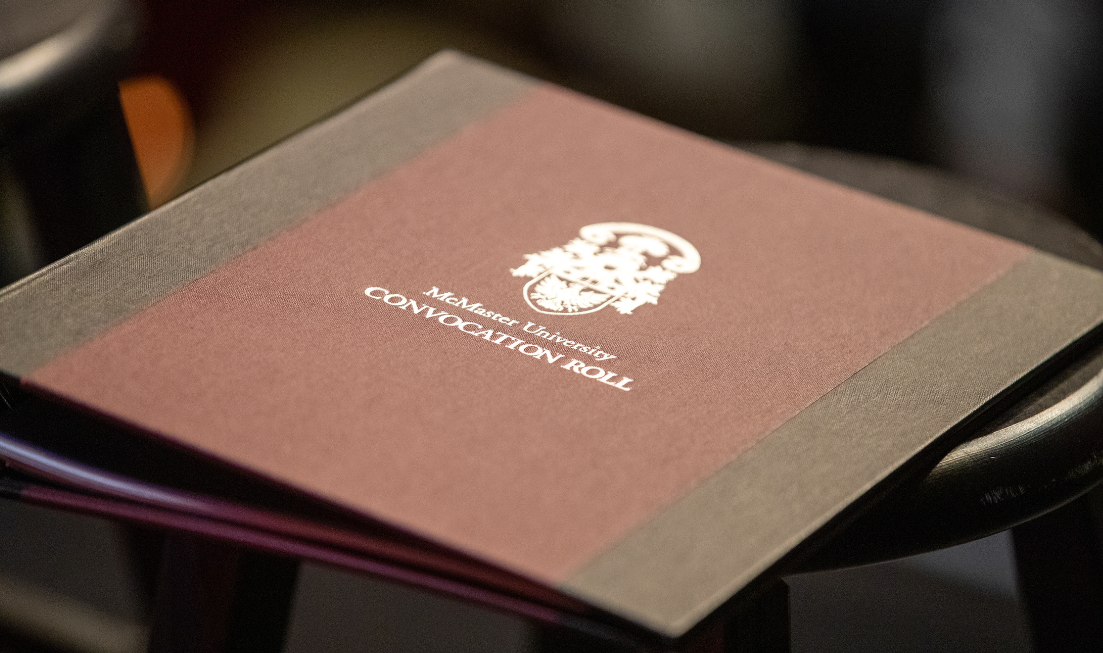 A folder with the McMaster crest and the words