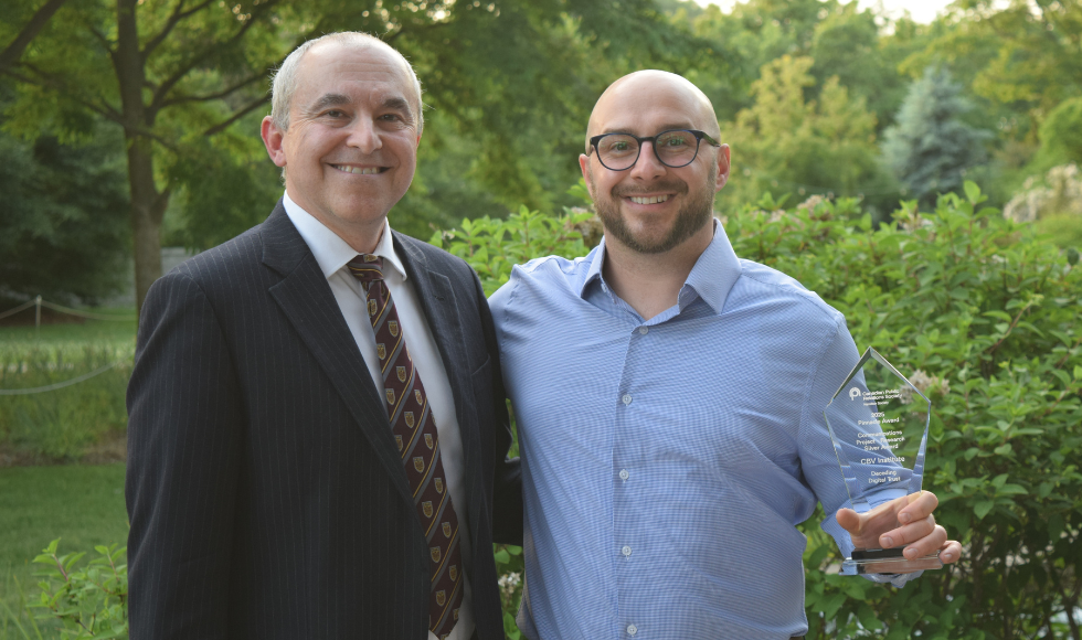 Two smiling people standing together